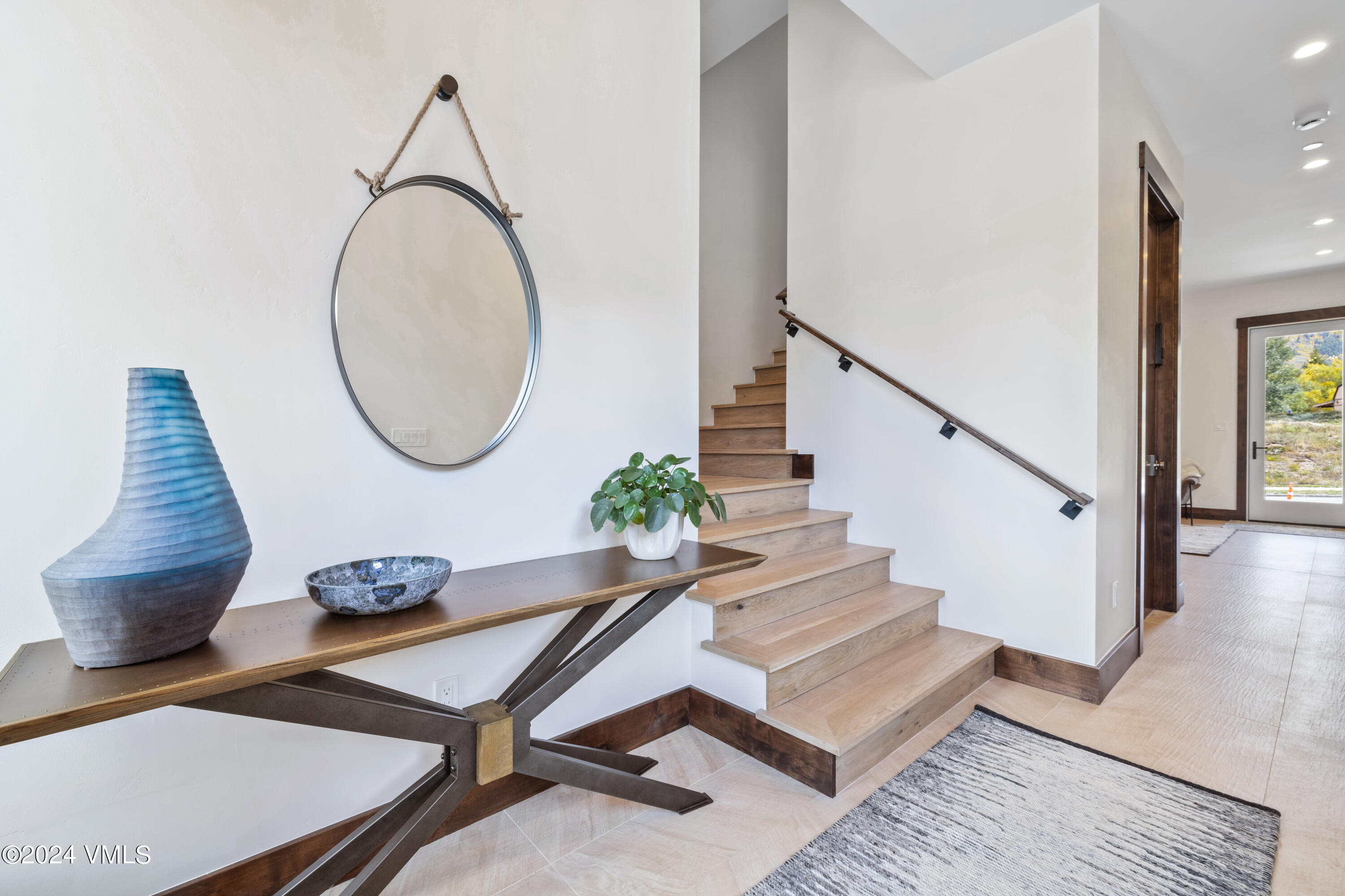 100 Goldfinch Lane, Unit 2B Avon, CO 81620 - Photo 30 of 47 a living room with furniture and a wooden floor