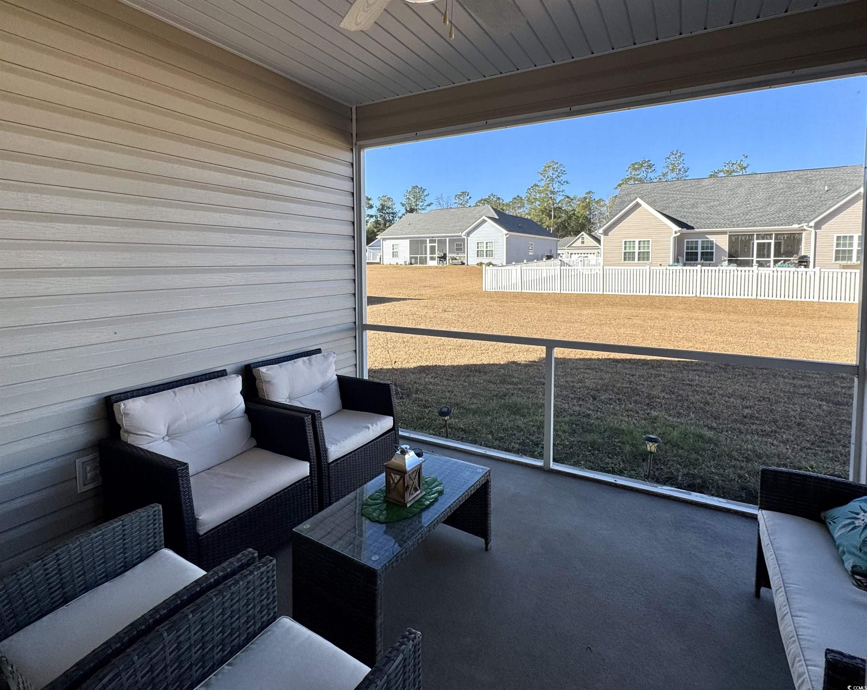 117 Baylee Circle Galivants Ferry, SC 29544 - Photo 16 of 17 View of patio featuring outdoor lounge area, ceiling fan, and a residential view
