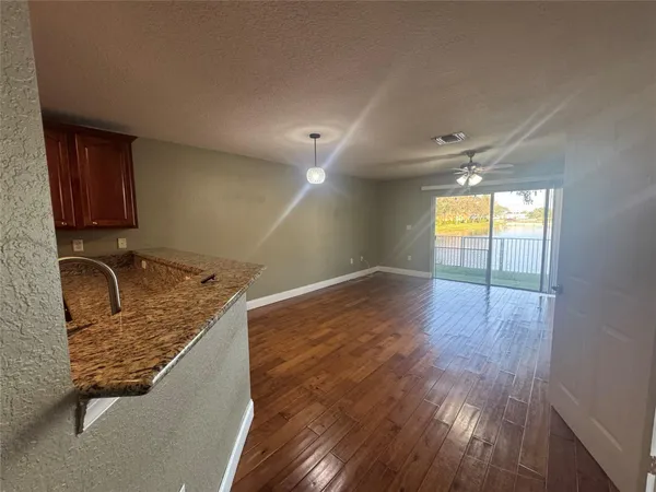 a room with wooden floor and window