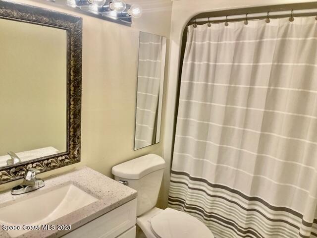 3243 Beach View Way Melbourne Beach, FL 32951 - Photo 15 of 35 a bathroom with a sink toilet and shower