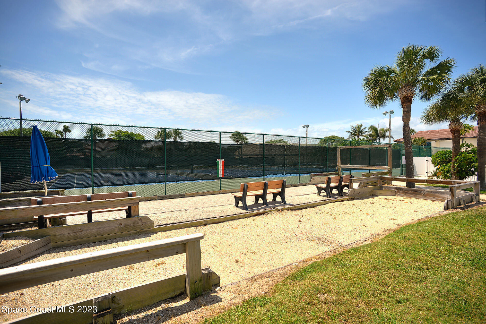 3243 Beach View Way Melbourne Beach, FL 32951 - Photo 23 of 35 a view of a swimming pool with a lounge chair