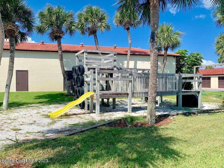 3243 Beach View Way Melbourne Beach, FL 32951 - Photo 31 of 35 a view of a house with swimming pool and sitting area