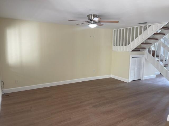 3243 Beach View Way Melbourne Beach, FL 32951 - Photo 4 of 35 a view of an empty room with wooden floor