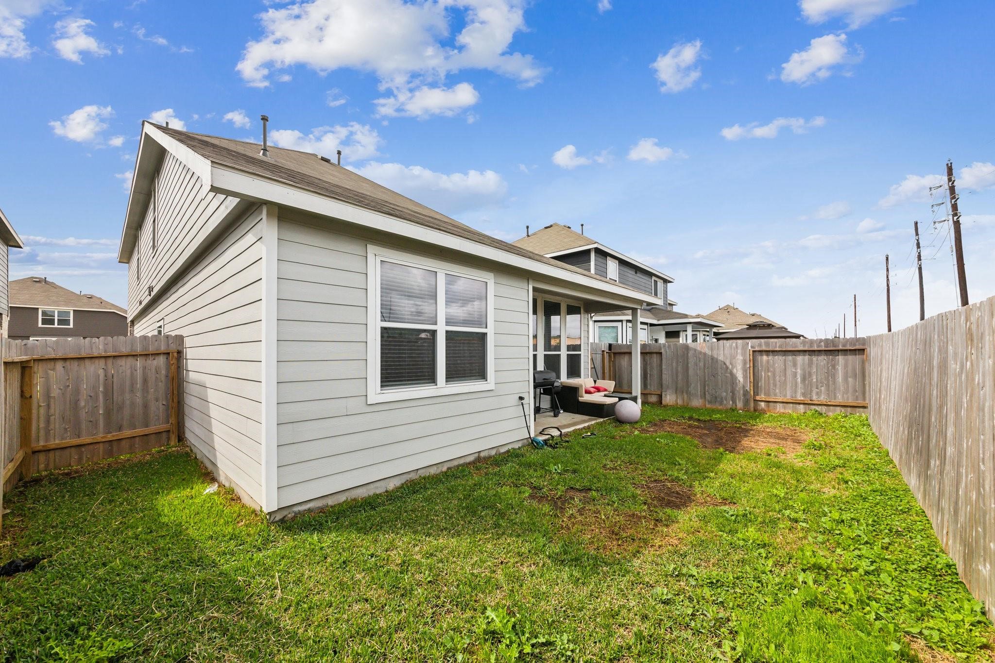 23534 Goodfellow Drive Spring, TX 77373 - Photo 11 of 13 a backyard of a house with table and chairs