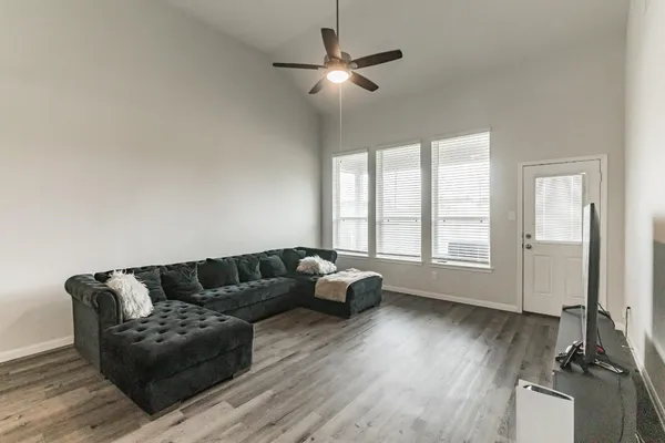 a living room with furniture and a large window