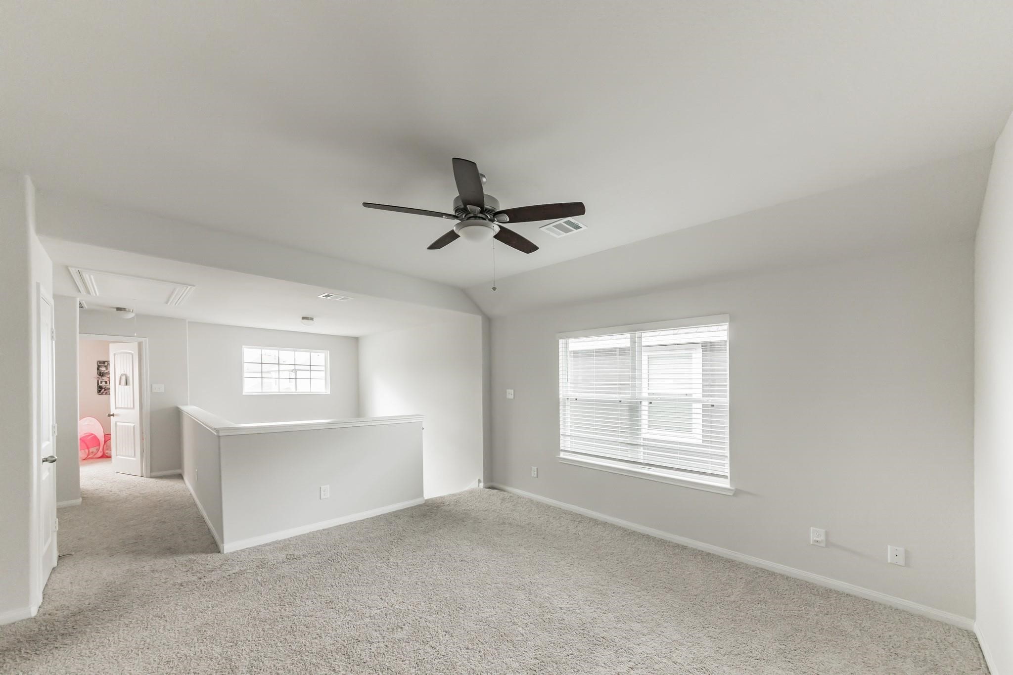 23534 Goodfellow Drive Spring, TX 77373 - Photo 10 of 13 a view of livingroom with hardwood floor and a window