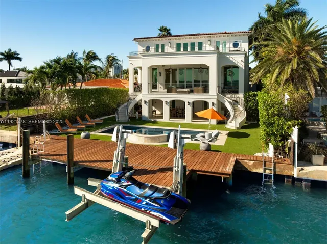 a view of a swimming pool with a lounge chairs