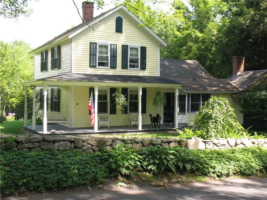 14 Hoppen Road New Hartford, CT 06057 - Photo 1 of 1 front view of a house with a yard