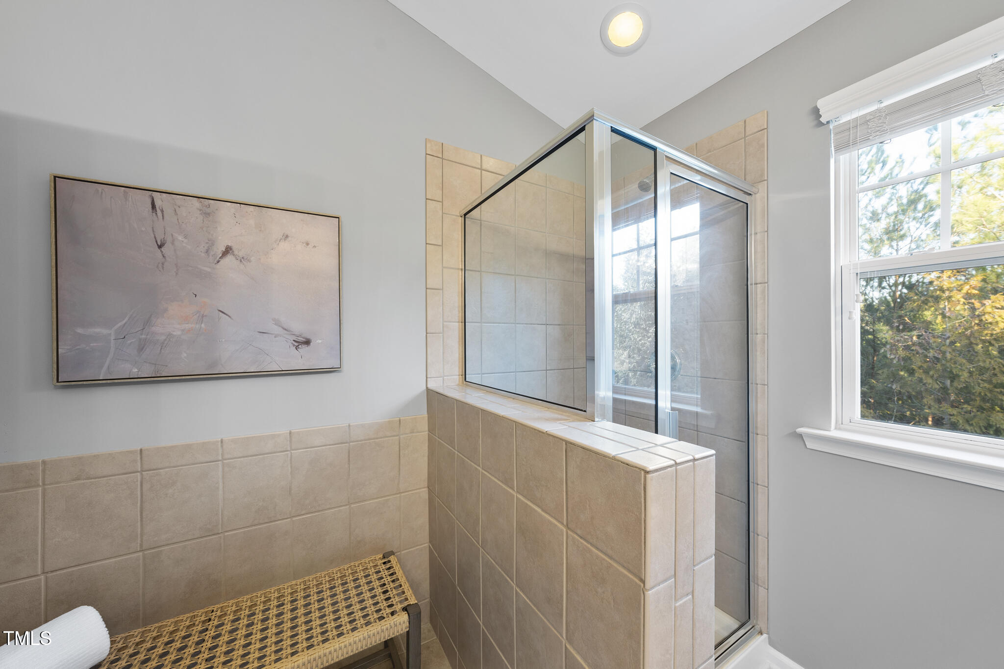 5006 Celtic Court Raleigh, NC 27612 - Photo 18 of 28 a bathroom with a bathtub and a shower