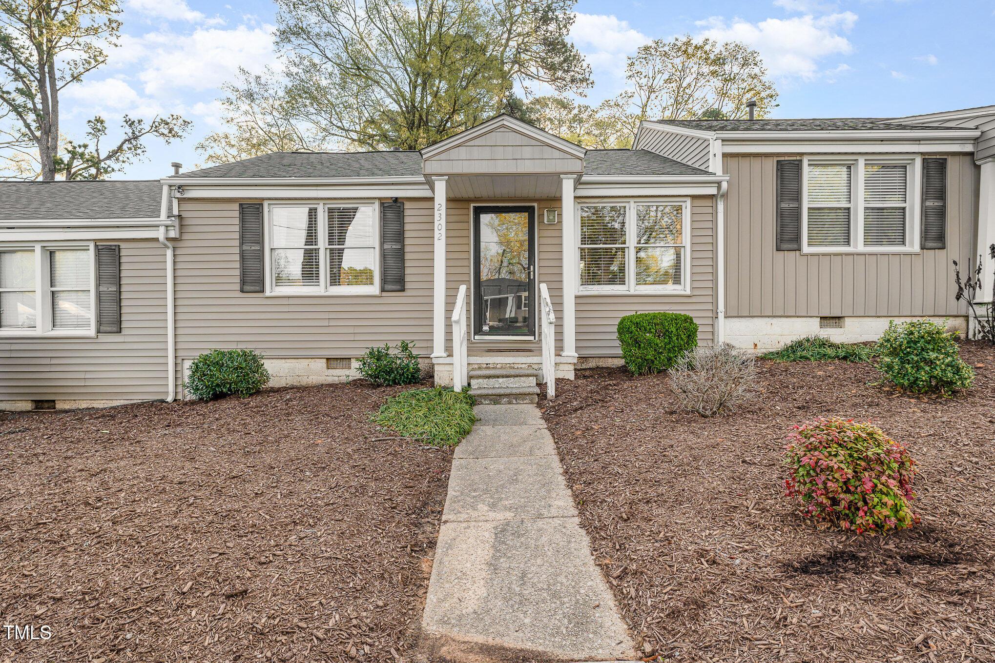 2302 Bernard Street Raleigh, NC 27608 - Photo 1 of 16 a front view of a house with garden