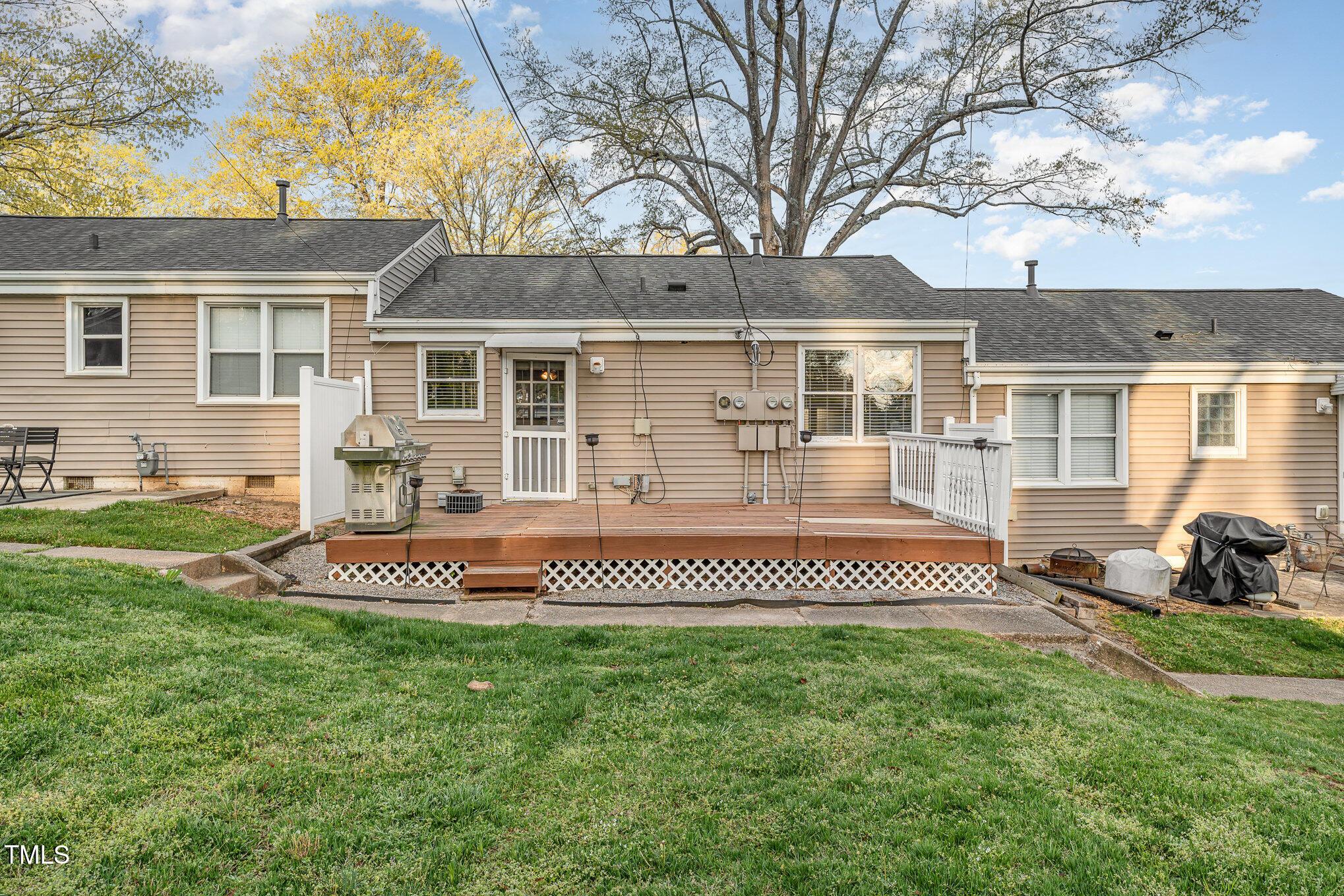 2302 Bernard Street Raleigh, NC 27608 - Photo 15 of 16 a front view of a house with a garden and porch
