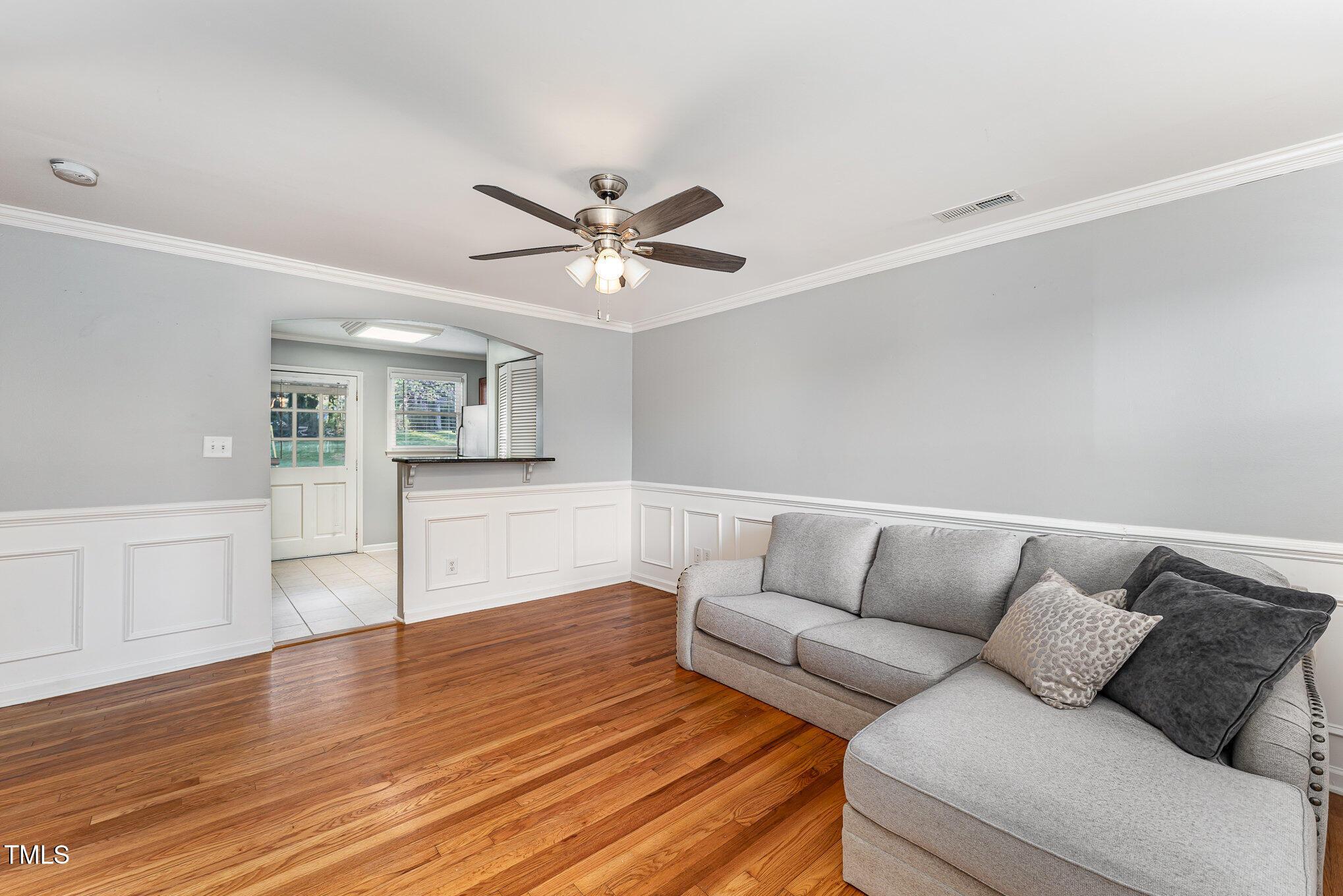 2302 Bernard Street Raleigh, NC 27608 - Photo 2 of 16 a living room with furniture and a wooden floor