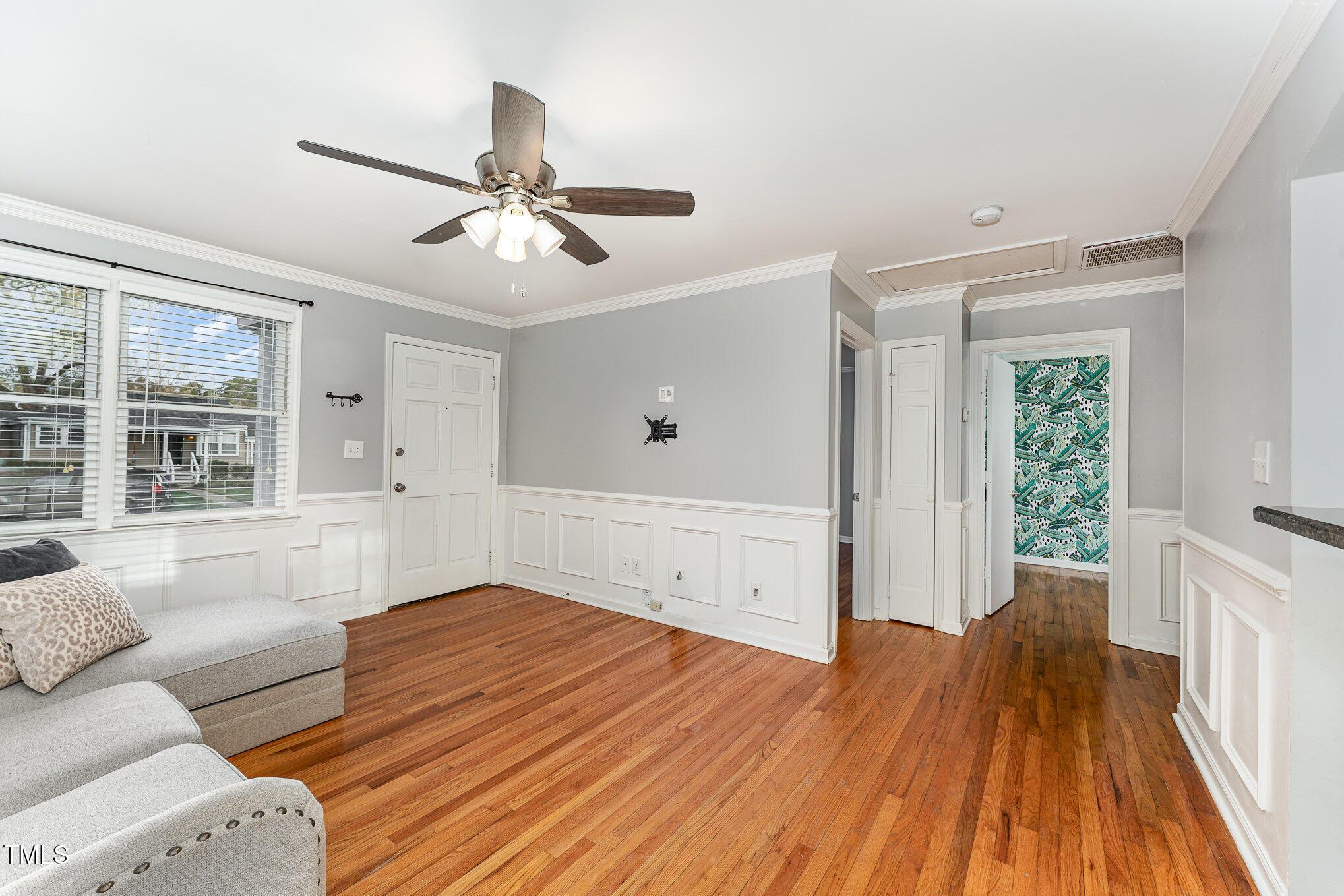 2302 Bernard Street Raleigh, NC 27608 - Photo 4 of 16 a living room with furniture and a wooden floor