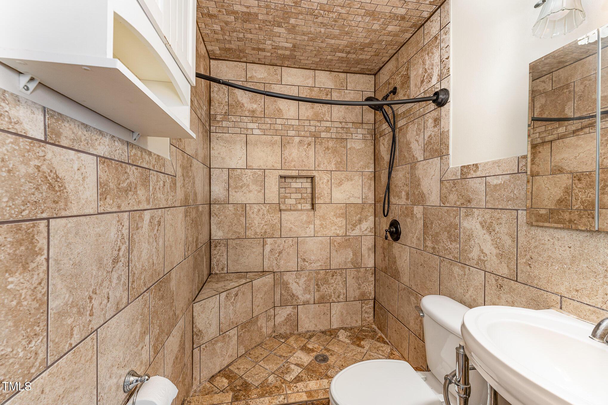 2302 Bernard Street Raleigh, NC 27608 - Photo 9 of 16 a bathroom with a sink toilet and shower