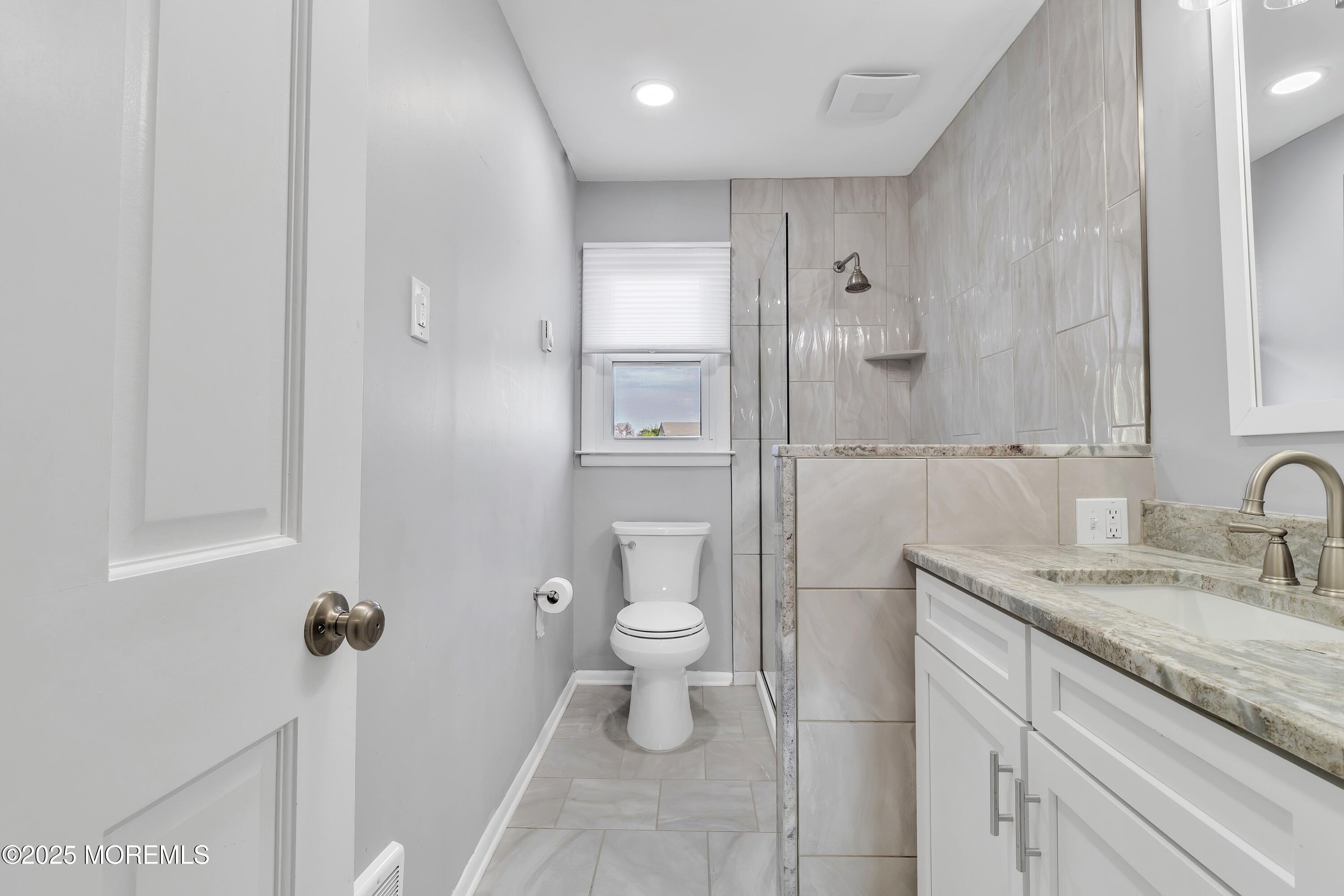 1 Markham Road Brick, NJ 08724 - Photo 24 of 63 a bathroom with a granite countertop sink a toilet and a mirror