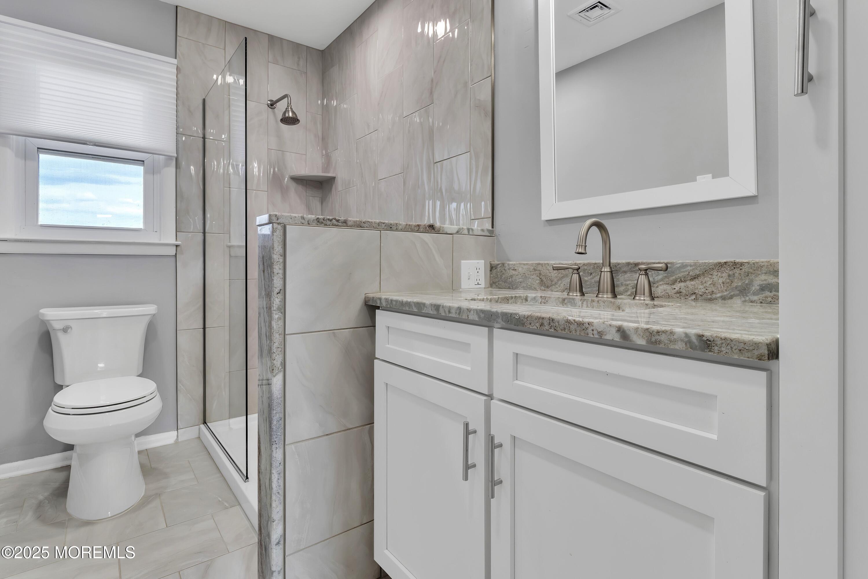 1 Markham Road Brick, NJ 08724 - Photo 26 of 63 a bathroom with a granite countertop sink toilet and a mirror