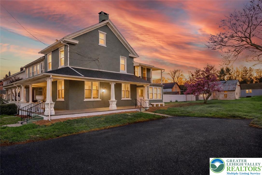 2213 Village Road Orefield, PA 18069 - Photo 1 of 41 a front view of a house with a yard and garage