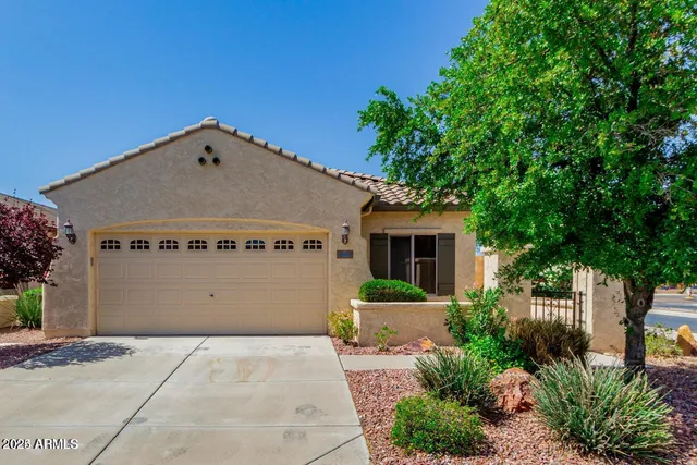 a front view of a house with a garage
