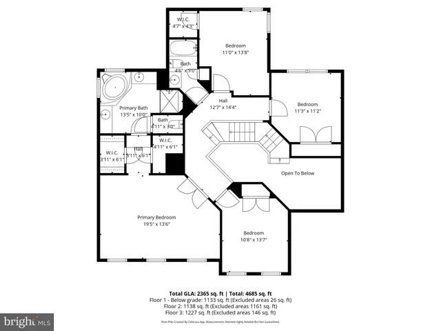 a front view of a house with garden and trees