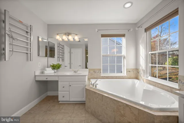 a spacious bedroom with a bed and cabinets