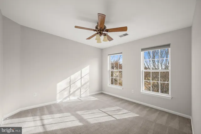 a spacious bathroom with a granite countertop tub sink and mirror