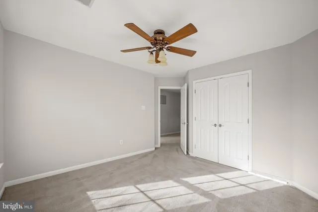 a spacious bathroom with a tub sink and mirror