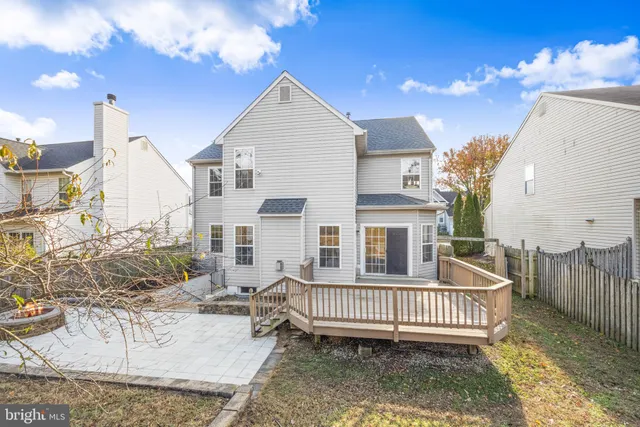 a view of a backyard with table and chairs