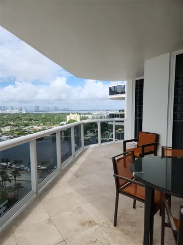 a view of a hallway with seating area