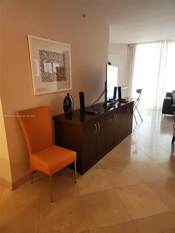 a kitchen with white cabinets stainless steel appliances and sink