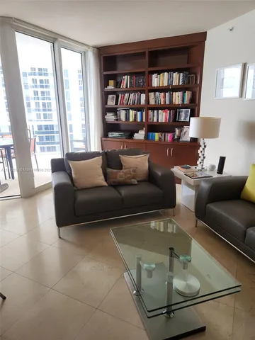 a lobby with furniture and a large window