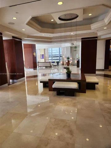 a view of a kitchen with a sink and dishwasher