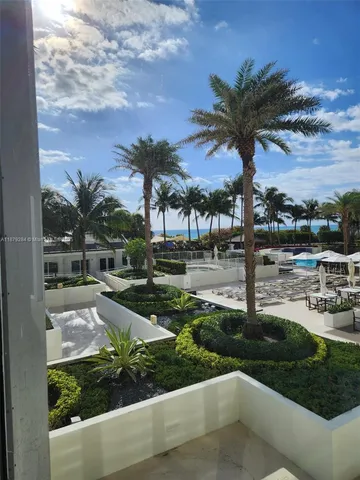 a room with table chairs and wooden floor