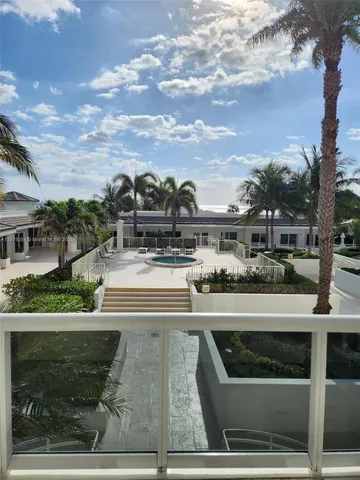 a view of room with painting on the wall and window