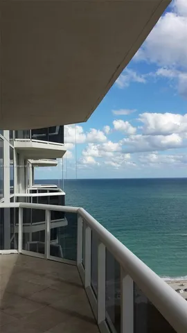 an aerial view of a city with lake view