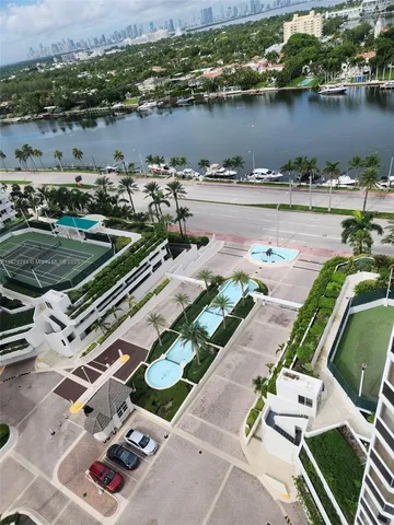 a bedroom with a bed and glass door