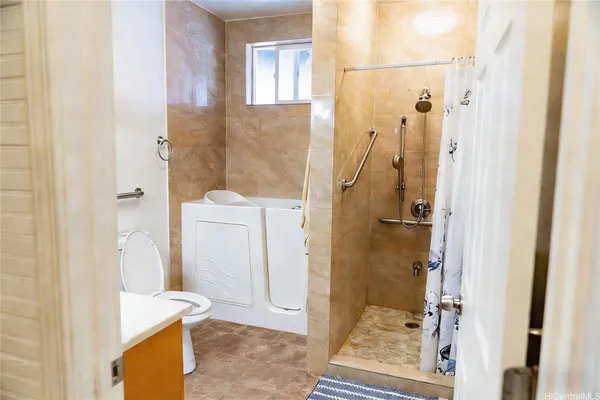 a bathroom with a tub and a sink