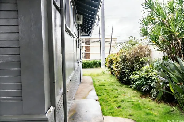 a view of a pathway both side of house