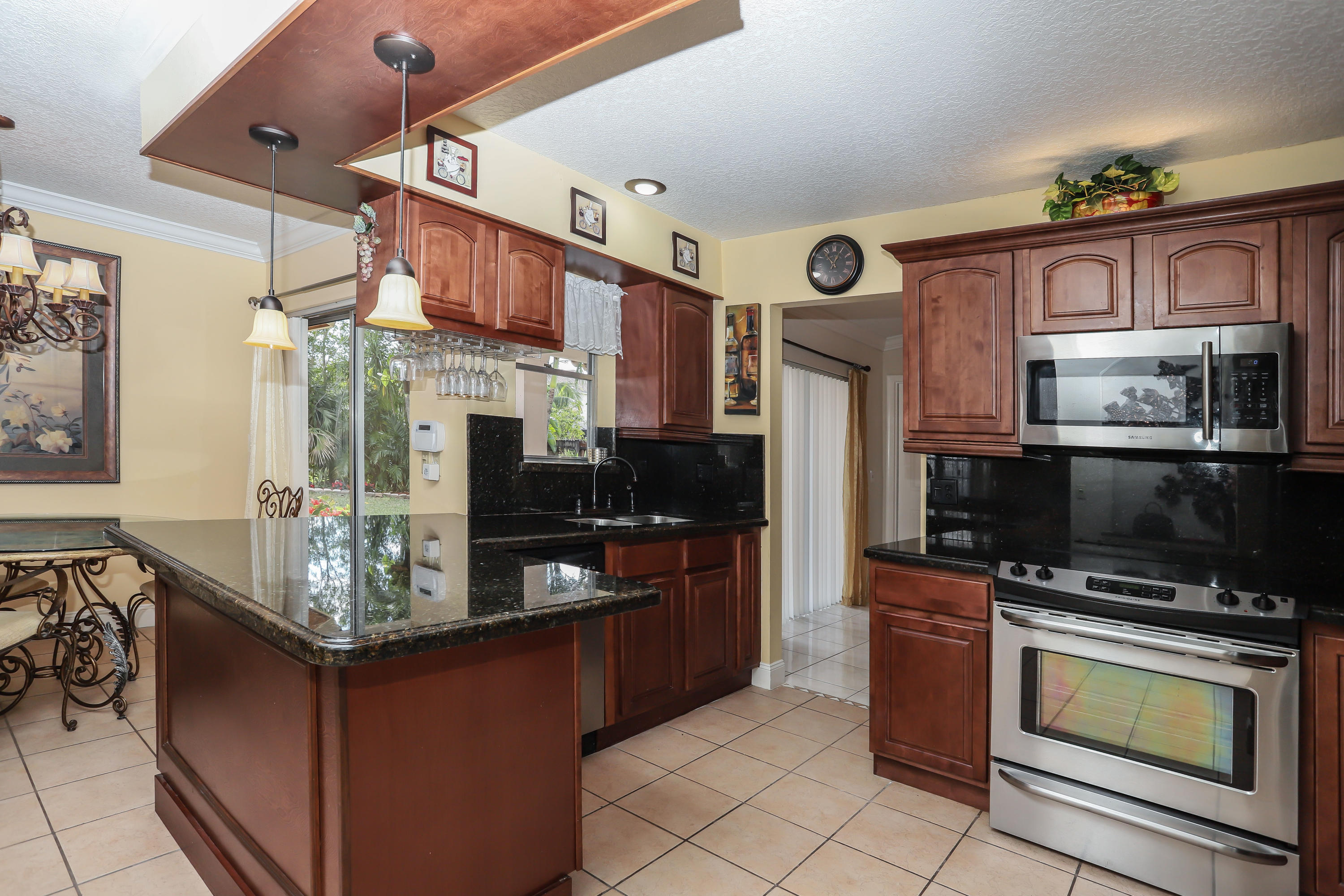 23090 Southwest 53rd Avenue Boca Raton, FL 33433 - Photo 3 of 19 Kitchen w/granite counters