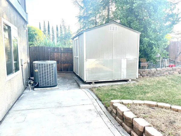 a backyard of a house with yard and staircase