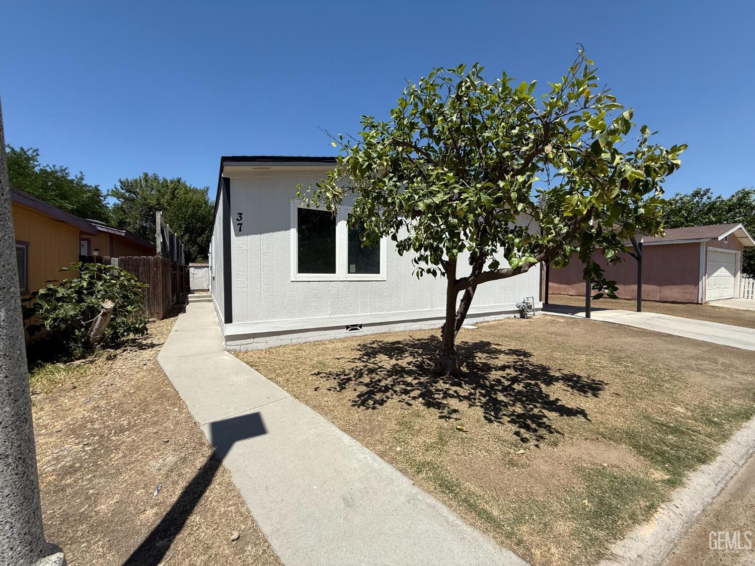 Undisclosed Address Bakersfield, CA 93307 - Photo 1 of 27 a view of a backyard of a house