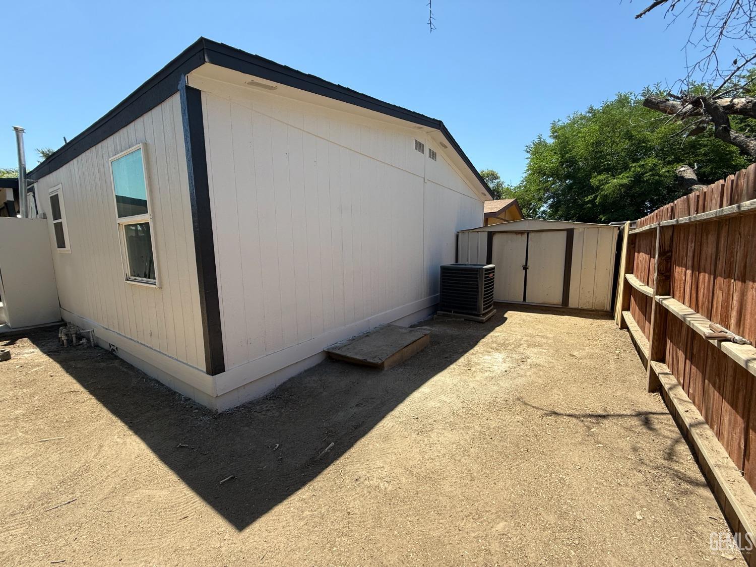 Undisclosed Address Bakersfield, CA 93307 - Photo 27 of 27 a view of wooden house with a large window