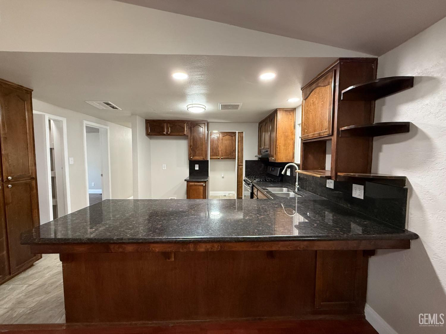 Undisclosed Address Bakersfield, CA 93307 - Photo 5 of 27 a view of a counter top space in a room
