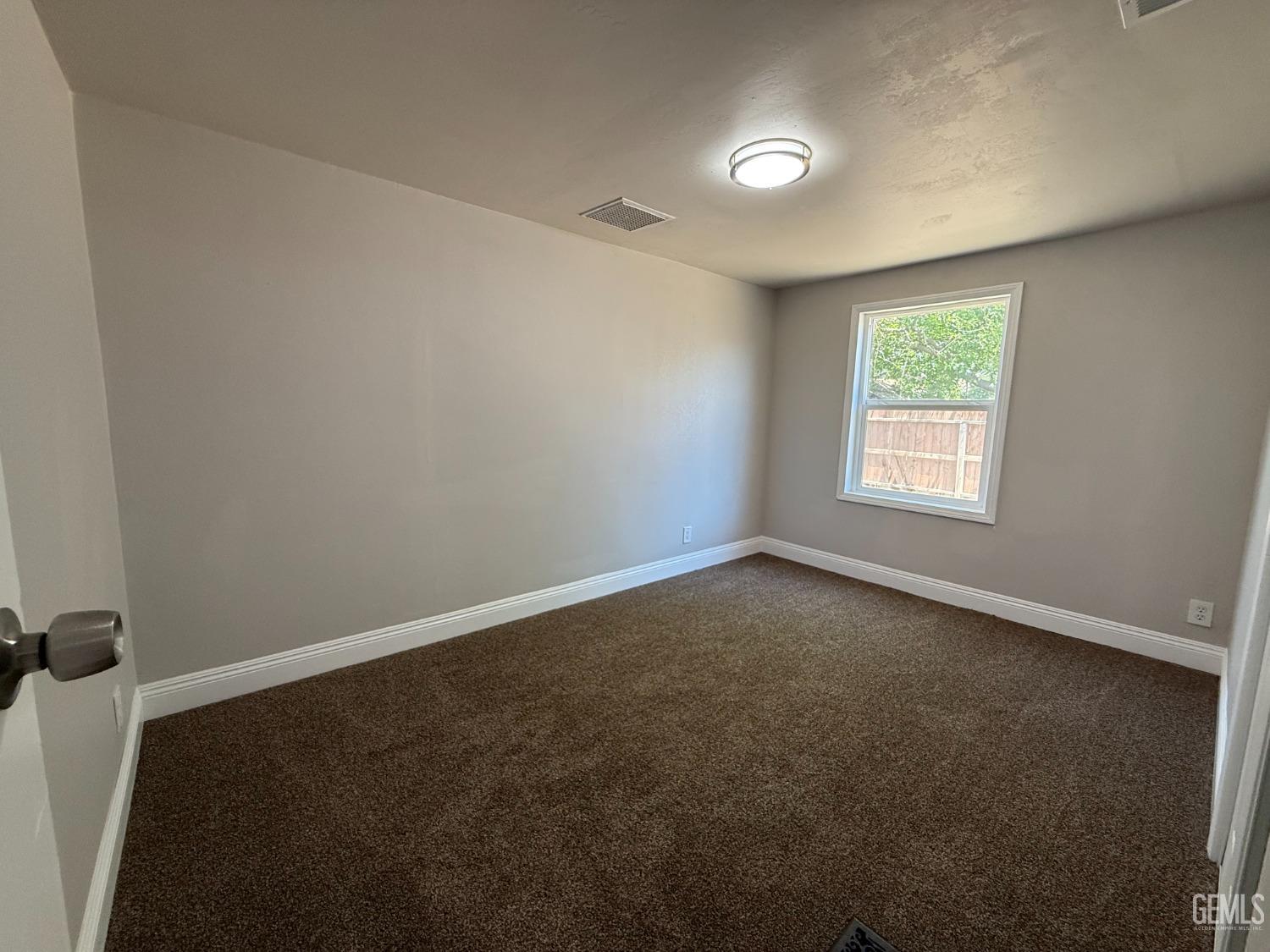 Undisclosed Address Bakersfield, CA 93307 - Photo 9 of 27 an empty room with a window