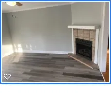 a view of living room with a fireplace