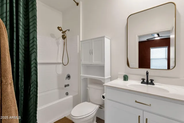 a living room with lots of furniture and a flat screen tv