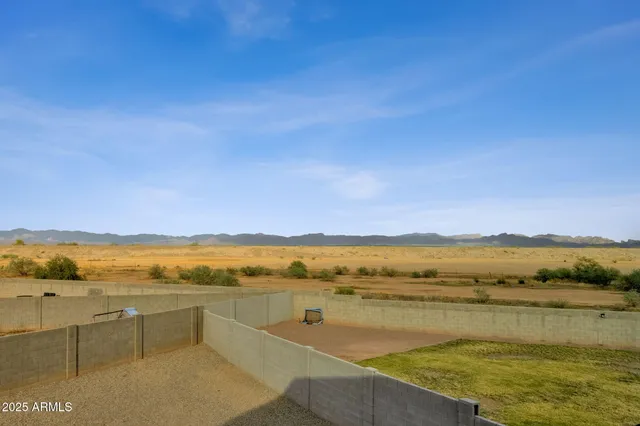 a spacious bathroom with a toilet sink and mirror