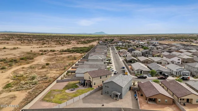 a view of a yard with an tree and a fence