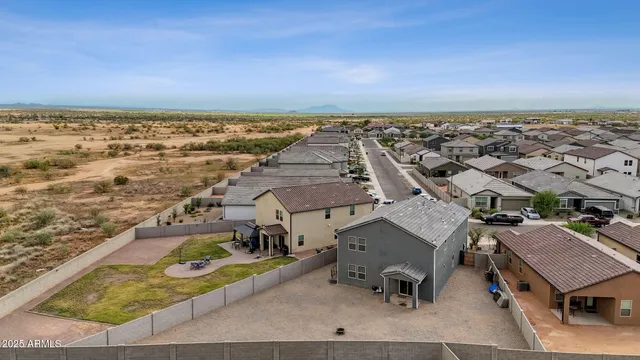 a view of a swimming pool with a patio and a slide