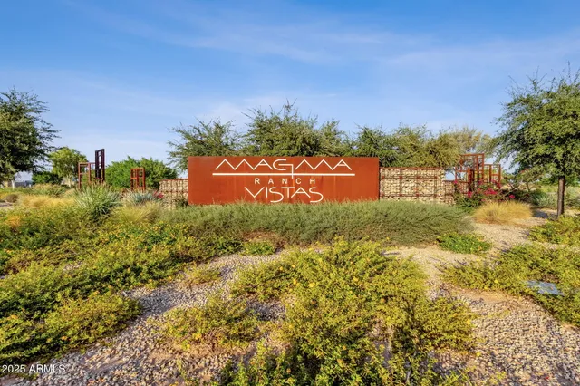 a view of house with backyard and outdoor seating