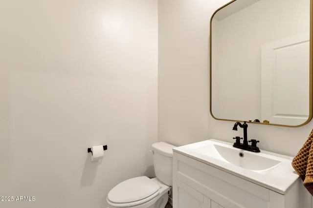 a living room with furniture a ceiling fan and a window
